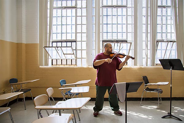 man playing viola