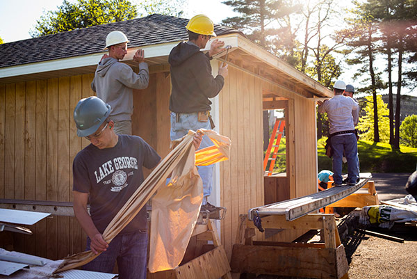 young men building a house