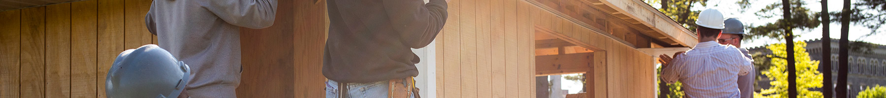 young men building a house