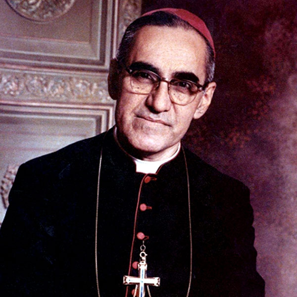 black and white photo of Oscar Romero laughing