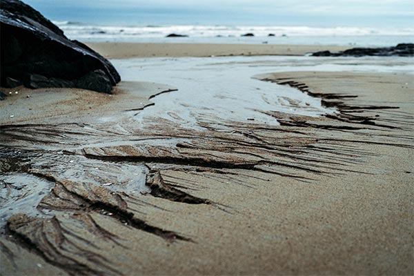 sand washing down a beach