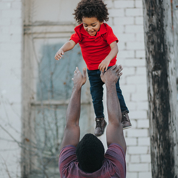 a father playing with his son