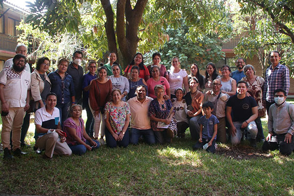 Group of people facing camera, after searching for the disappeared.