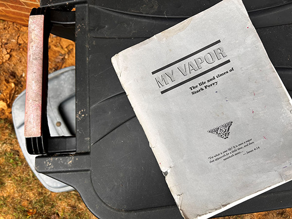 a book on top of a dumpster