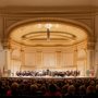 Crowd enjoying orchestra performance in Carnegie Hall