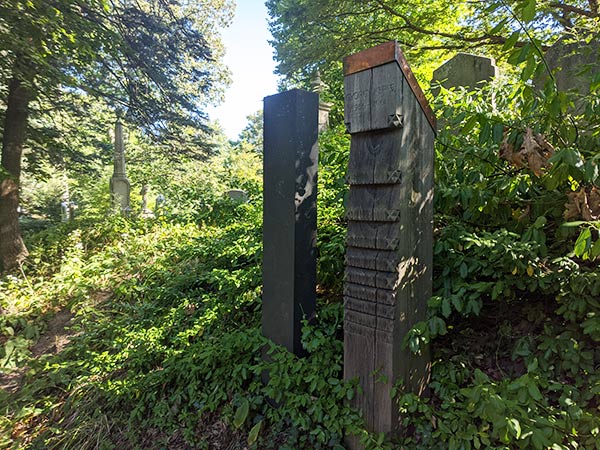 wooden headstones in a cemetery