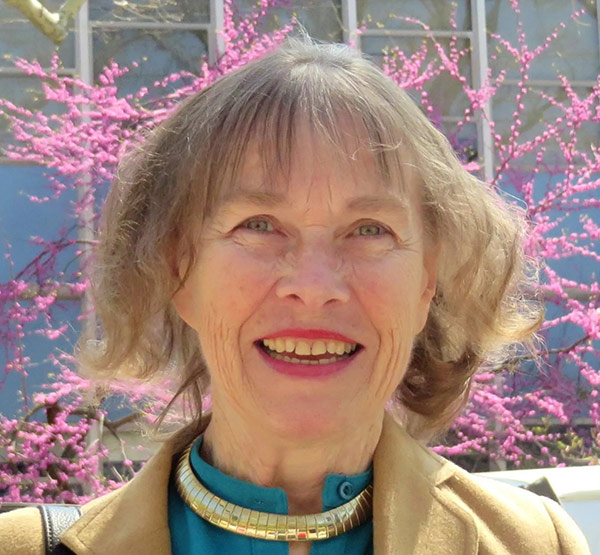 portrait of a woman by a flowering tree