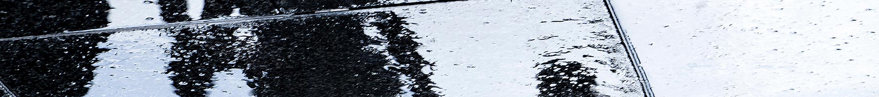 shadows of a parent and children on a rainy day