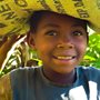 Ugandan boy carries supplies home