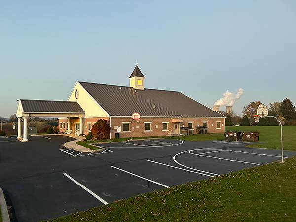 a church with the Limerick Nuclear Generating Station in the background