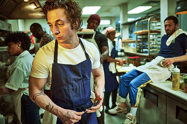 employees working in a restaurant kitchen