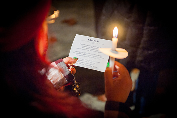 a woman holding a candle