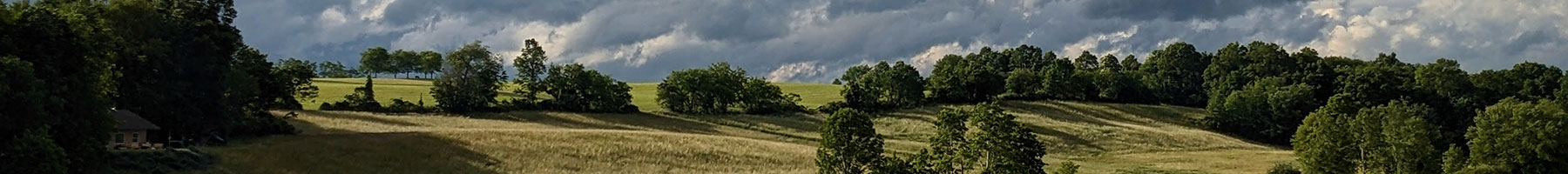 rolling hills under a cloudy sky