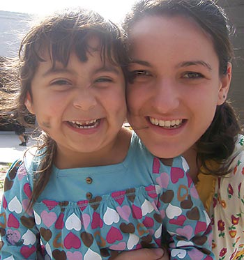 woman hugging girl