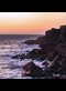 sunset over a rugged coast