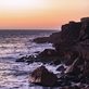 sunset over a rugged coast