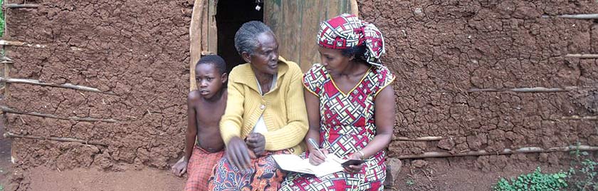 Denise, (right) visiting the home of a genocide widow in Mukoma to hear her story