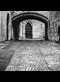 black and white photo of cobbled street