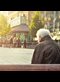 sad man sitting on park bench