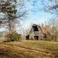 a barn in an autumn woods