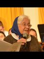 Marlys Swinger introducing one of her choral works