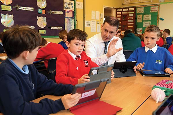 James Moyna teaching a “shared education” class mingling Catholic and Protestant children from three local primary schools