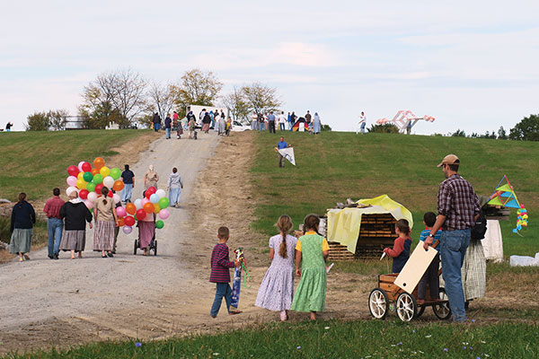 crowd of people on their way to the kite festival