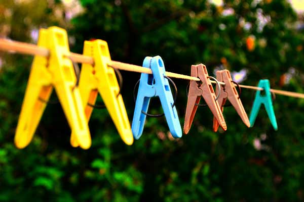 Colorful clothespins on a clothesline