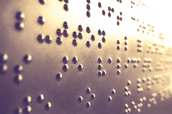 Instructions are repeated in braille on a ticket-validating machine at a train station in Portland, Oregon.