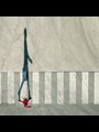 overhead view of a young woman in red on a crosswalk