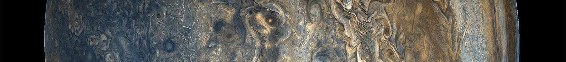 tan and blue swirls and patterns in the clouds of Jupiters atmosphere