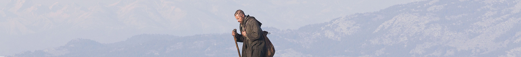 a man climbing in the mountains