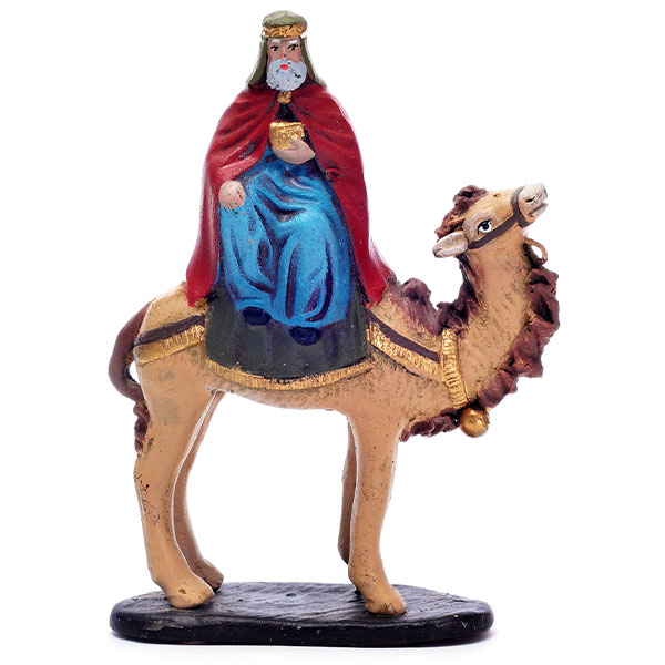 painted carving of a king on a camel