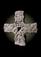 a carved stone cross on a black background