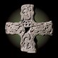 a carved stone cross on a black background