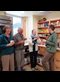 four people sharing coffee together
