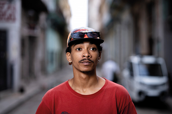 a young man wearing a red shirt