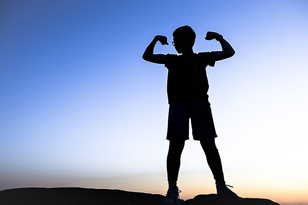 silhouette of a young boy