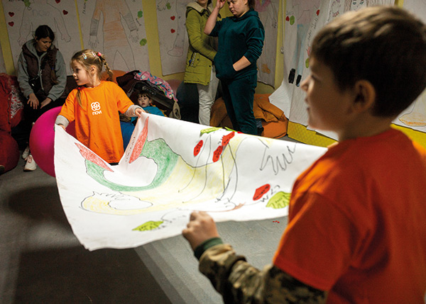 children carrying a picture