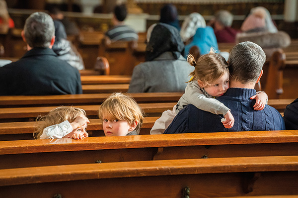 children in a church pew