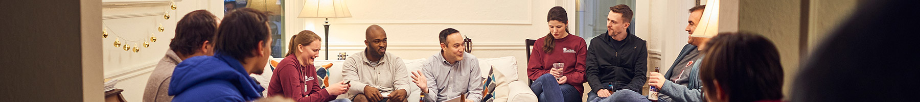 people sitting in a circle in a room