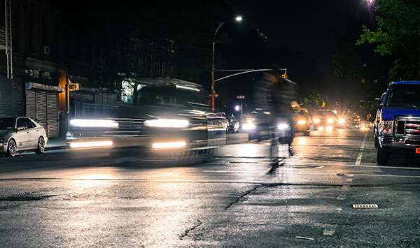 car lights on a dark wet road