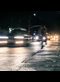 car lights on a dark wet road