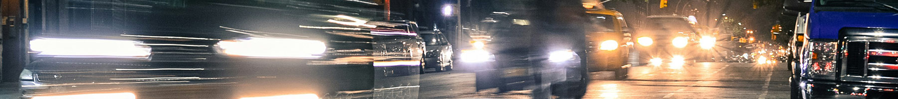 car lights on a dark wet road