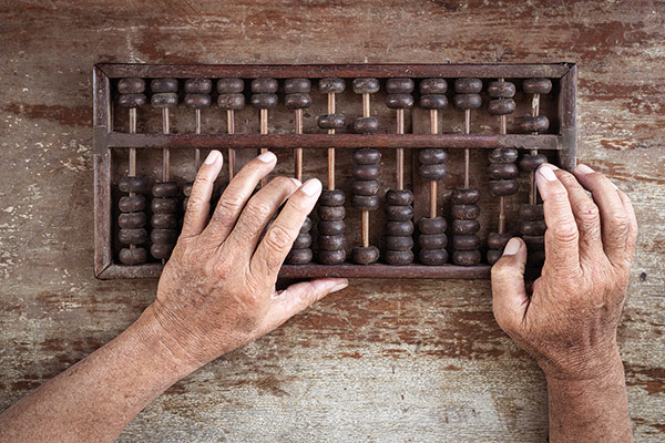 hands using an abacus