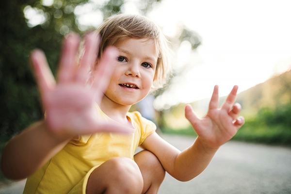 child counting with their fingers