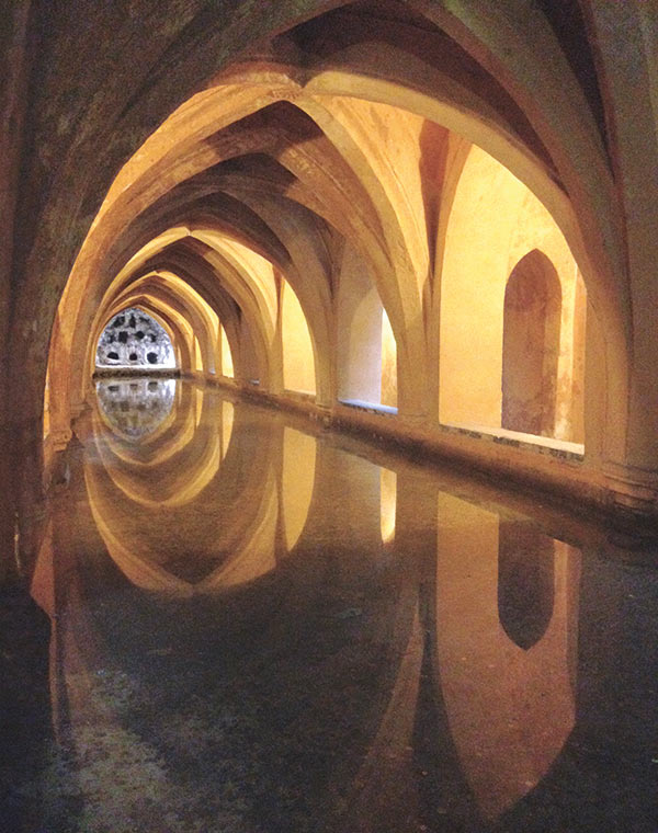 painting of an arched hallway