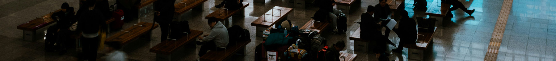 people at desks in a large room