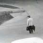 man with bags on a road