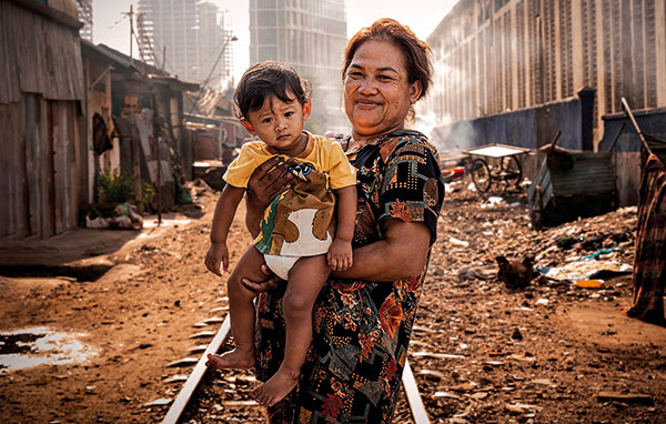 woman and child in poor neighborhood